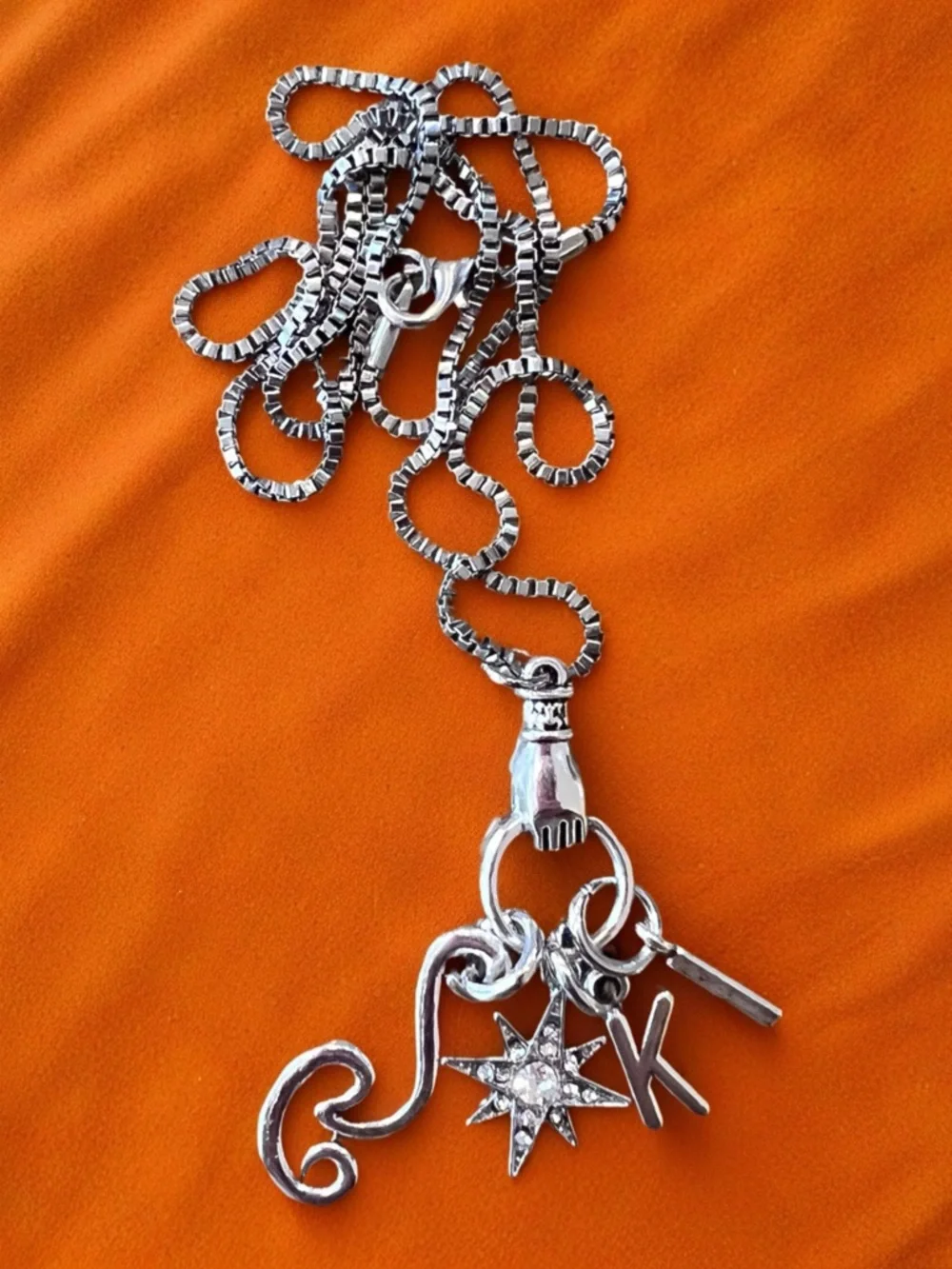 Monk DND necklace with the wind, a star, and KI Dungeons and Dragons jewelry